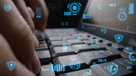 A close-up view of a hand typing on a laptop keyboard, enhanced with digital interface elements...