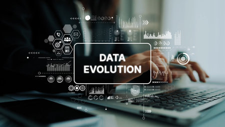 Business professional typing on laptop with overlay graphics showcasing data evolution and analytics concepts. Asymptotic smart data analytic.の写真素材