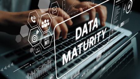 Hands Typing on Laptop with Data Maturity Concept Graphical Elements and Digital Graphics Overlay. Asymptotic smart data analytic.の写真素材