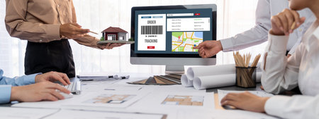 Group of interior architect designer discussing together on blueprint and laptop screen display...