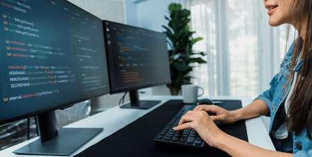Young Asian in IT developer creating with typing online information on pc with coding program data...