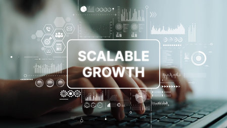 Hands Typing on Keyboard with Digital Interface Showing Scalable Growth Concept in Business and...