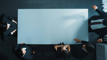 Top down aerial view of business team shaking hand and clapping hands to celebrate young...