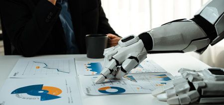 A robotic arm analyzes business charts and graphs while a person sips coffee in a modern office....
