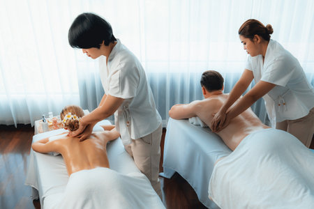 Caucasian couple customer enjoying relaxing anti-stress spa massage and pampering with beauty skin...