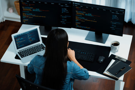 Top view young Asian IT developer creating with typing online information on pc with coding program...