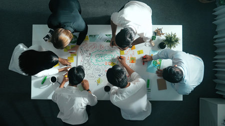 Top view of professional business team working together to brainstorm environmental idea by using mind map. Aerial view of smart manager talking and discussing about sustainable energy. Alimentation.の写真素材