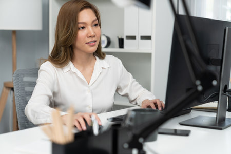 Portrait of beautiful businesswoman working on computer for checking email for sales report highest...