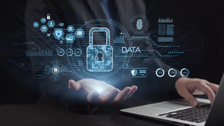 A conceptual image showcasing hands holding digital lock symbols above a laptop, highlighting themes...