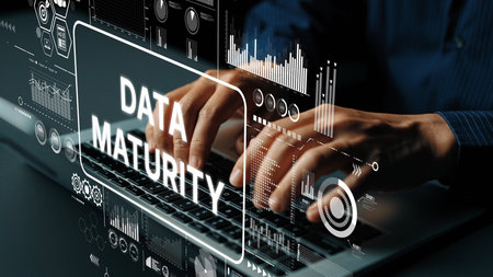 Hands Typing on Keyboard with Futuristic Data Maturity Graphics and Statistics in a Technology Workspace. Asymptotic smart data analytic.の写真素材