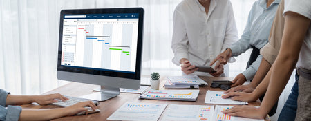 Project planning software for brisk business project management on the computer screen showing...