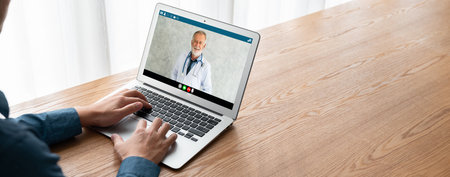 Doctor video call online by modish telemedicine software application for virtual meeting with patientの写真素材