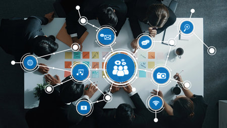 A top-down view of a diverse business team engaging in collaboration within a modern workspace,...
