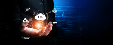 Business person implements initiatives to reduce CO2 emissions, aiming for net zero. Showcases...