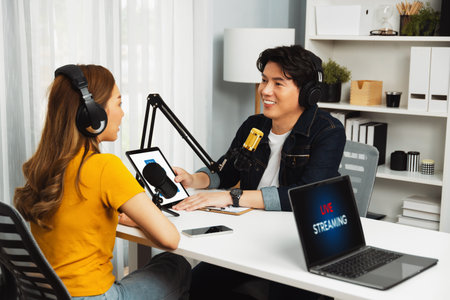 Smiling radio influencer host wearing headphones interview woman speaker social media online live...