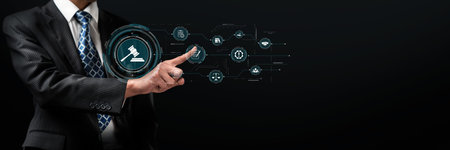 A business professional in a suit utilizes advanced digital interfaces to engage with icons representing compliance, regulation, and quality management in a legal setting.の写真素材