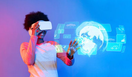 A young user engages with advanced virtual reality technology, exploring innovative concepts of...