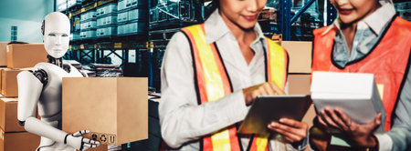 Innovative industry robot working in warehouse together with human worker . Concept of artificial...
