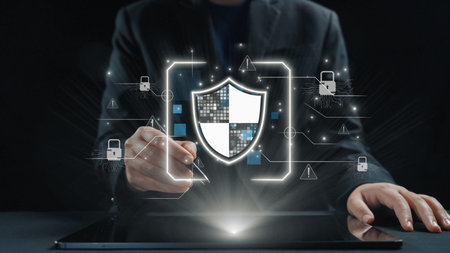 A professional man in a suit interacts with a tablet, illustrating digital security with a shield...