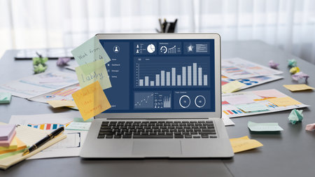 Sticky note for creative and analytic brainstorm for business idea with BI data dashboard on laptop...