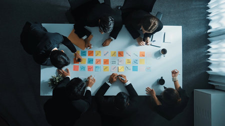 Time lapse of professional business team discuss while project manager join meeting. Group of diverse people writing and choose marketing idea or plan on table with sticky notes placed. Directorate..の写真素材