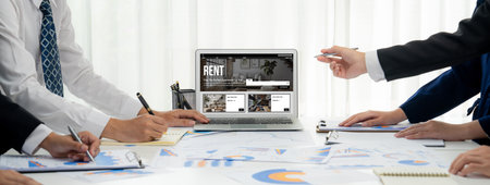 Online real estate rental search brisk on computer. House home or apartment rental website online.の素材