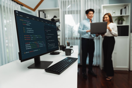 Running on coding programming intelligence system on computer screen with blurry IT developers...
