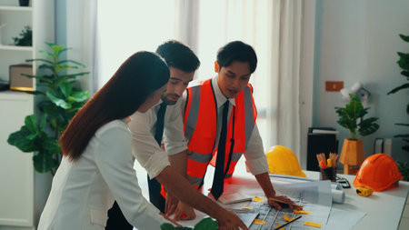 Top view of project manager and civil engineer holding laptop while explain idea to architect....