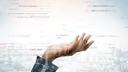 A hand reaches out amidst a backdrop of digital code and an urban skyline, symbolizing the intersection of technology and society in the digital age.の写真素材