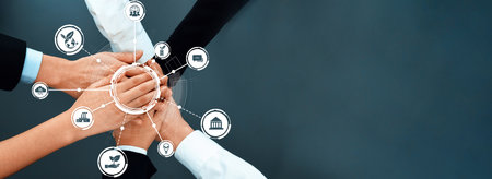 This image captures a dynamic representation of teamwork with diverse hands joined together,...
