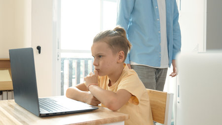 Smart boy using laptop to generated AI by coding engineering prompt. Diverse student learning or...