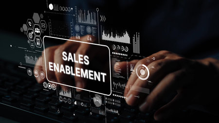 Hands Typing on Keyboard with Digital Sales Enablement Graphics in Background for Business Growth...