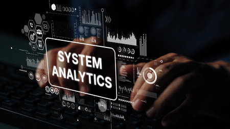 Hands Typing on Keyboard with Overlay of Data Analytics Graphics and System Metrics for Technology...