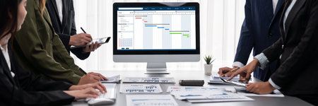 Panorama shot analyst team utilizing BI to analyze financial report with laptop. Businesspeople...