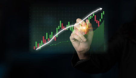 A businessman interacts with a digital graph showcasing financial growth in the stock market,...