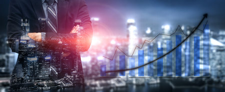 A confident businessman stands against a city skyline, symbolizing success and growth. A financial...