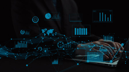 A professional analyzing data on a laptop, surrounded by digital charts and graphs. This image...