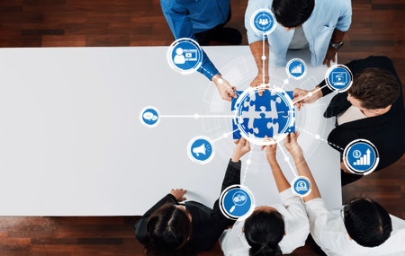 A diverse team collaborates around a globe, engaging with digital icons that symbolize marketing strategies, analytics, and business growth in a modern workspace.の写真素材