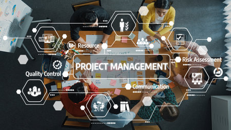Diverse team collaborating on project management strategies at a modern workspace using innovative tools and concepts for effective workflow enhancement.の写真素材