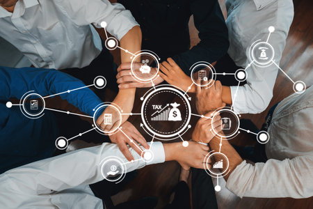 A dynamic teamwork scene showcasing diverse hands engaging in financial strategy and tax planning....