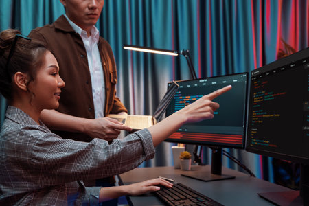 IT developers discussing with point to intelligent website development coder system running data...