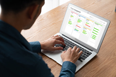 Project planning software for modish business project management on the computer screen showing timeline chart of the team projectの写真素材
