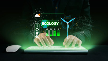 A creative representation of hands typing on a keyboard, surrounded by glowing graphics that highlight ecology, renewable energy, and sustainability for a better future.の写真素材