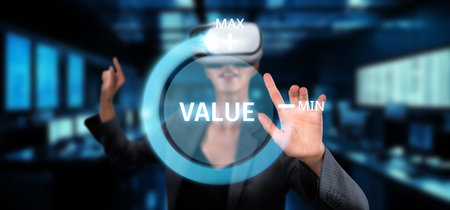 A business professional uses virtual reality technology to explore strategies for maximizing value and achieving success in consulting and financial growth.の写真素材