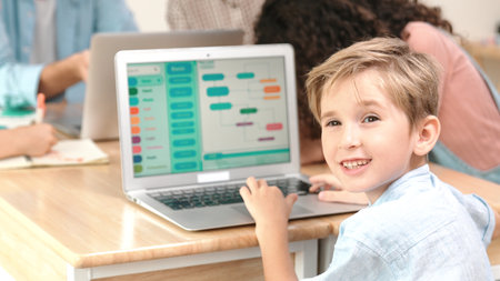 Smart caucasian boy looking at camera in STEM technology class while group of diverse student and teacher doing mind mapping. Skilled child learning coding software program or generate AI. Pedagogy.の写真素材
