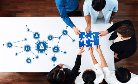 A diverse group of professionals collaborates on problem-solving using puzzle pieces and network...