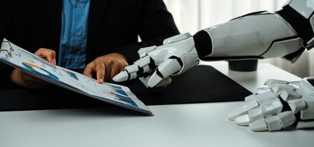 A robotic hand interacts with a business report during a meeting, highlighting the integration of technology into professional environments and future collaboration.の写真素材