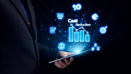 A business professional interacts with a tablet displaying icons related to cost reduction and data...