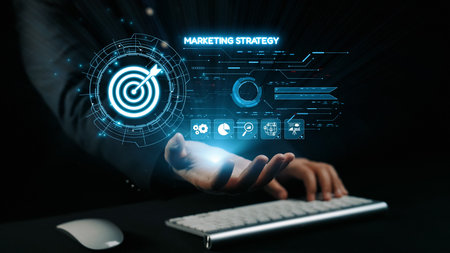 A businessman interacts with a futuristic digital interface displaying marketing strategy elements like targets and analytics. This image highlights innovation and data-driven decision-making.の写真素材