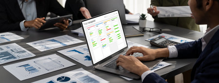 Project planning software for brisk business project management on the computer screen showing...